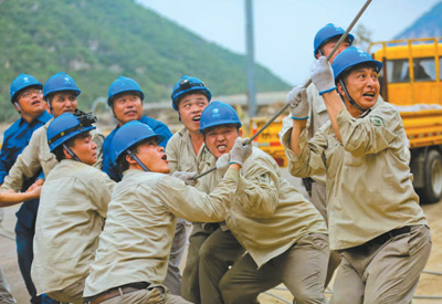 人民日?qǐng)?bào):防汛抗洪救災(zāi) 央企勇挑重?fù)?dān)